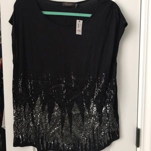 The limited black sequin blouse